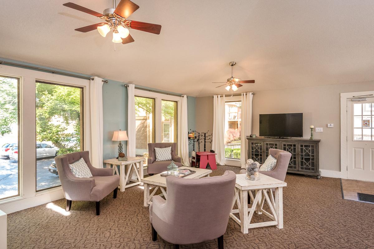 Clubhouse with a television and a fan.