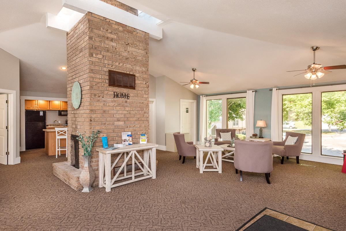 Clubhouse with a brick chimney and a fireplace.